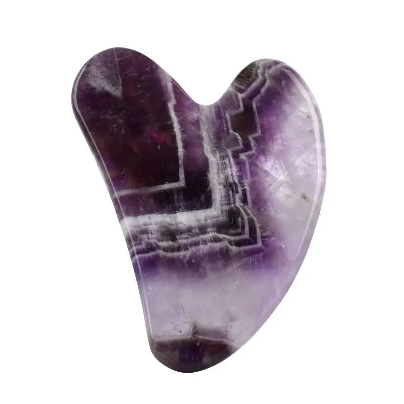 Facial gua sha stone massager, purple amethyst-like crystal with raised geometric lines