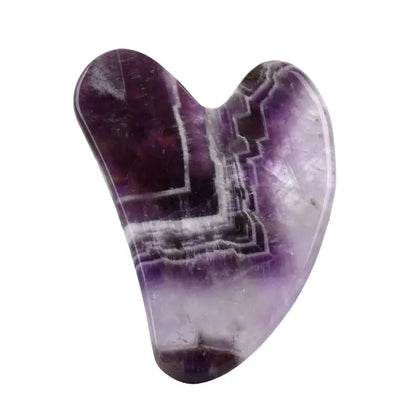 Facial gua sha stone massager, purple amethyst-like crystal with raised geometric lines