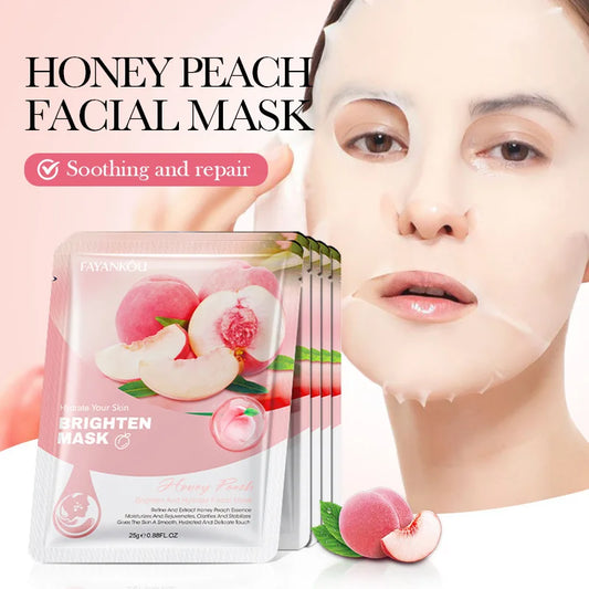 Honey peach facial mask packet with soft pink fruit graphics and sheet-mask label
