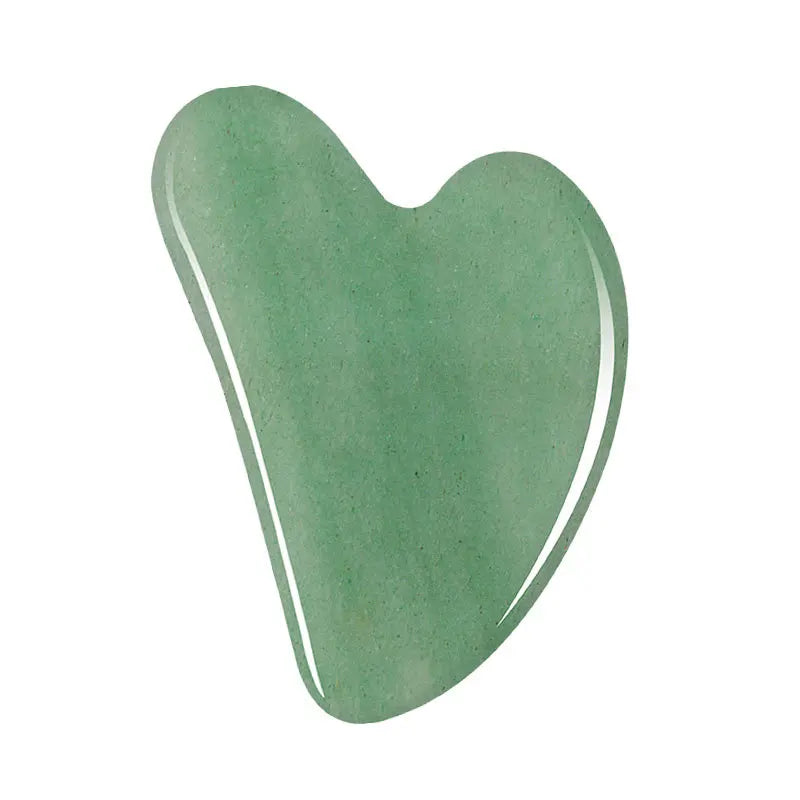 Facial gua sha stone tool, green translucent heart shape with smooth edges