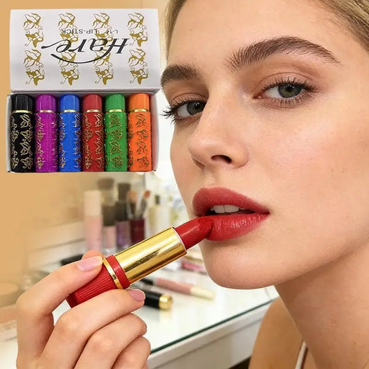 Red lip lipstick tube with gold cap beside a 6-color lip gloss set box.
