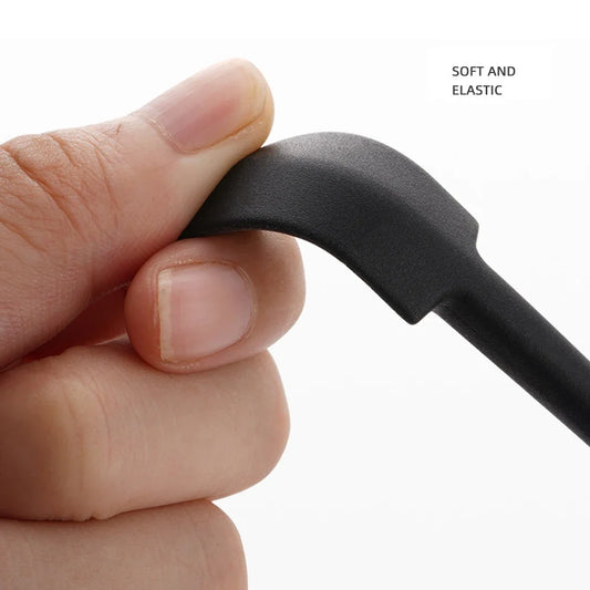 Black silicone residue scraper spoon with curved handle, mini size