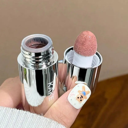 Pink liquid blusher stick with dome sponge applicator in chrome container