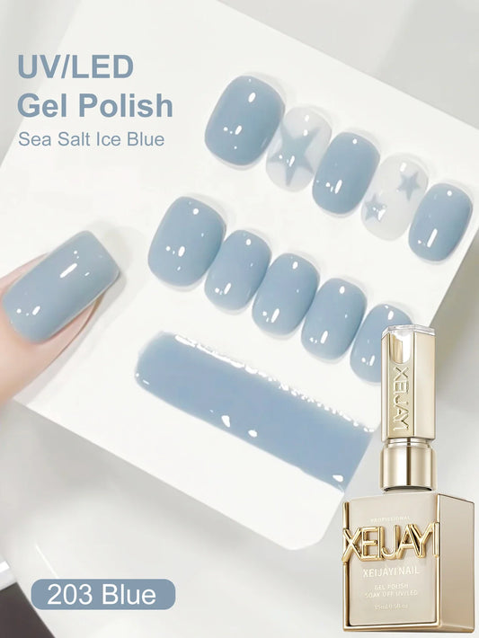 Sea salt ice blue UV LED gel polish on short rounded nails with bottle