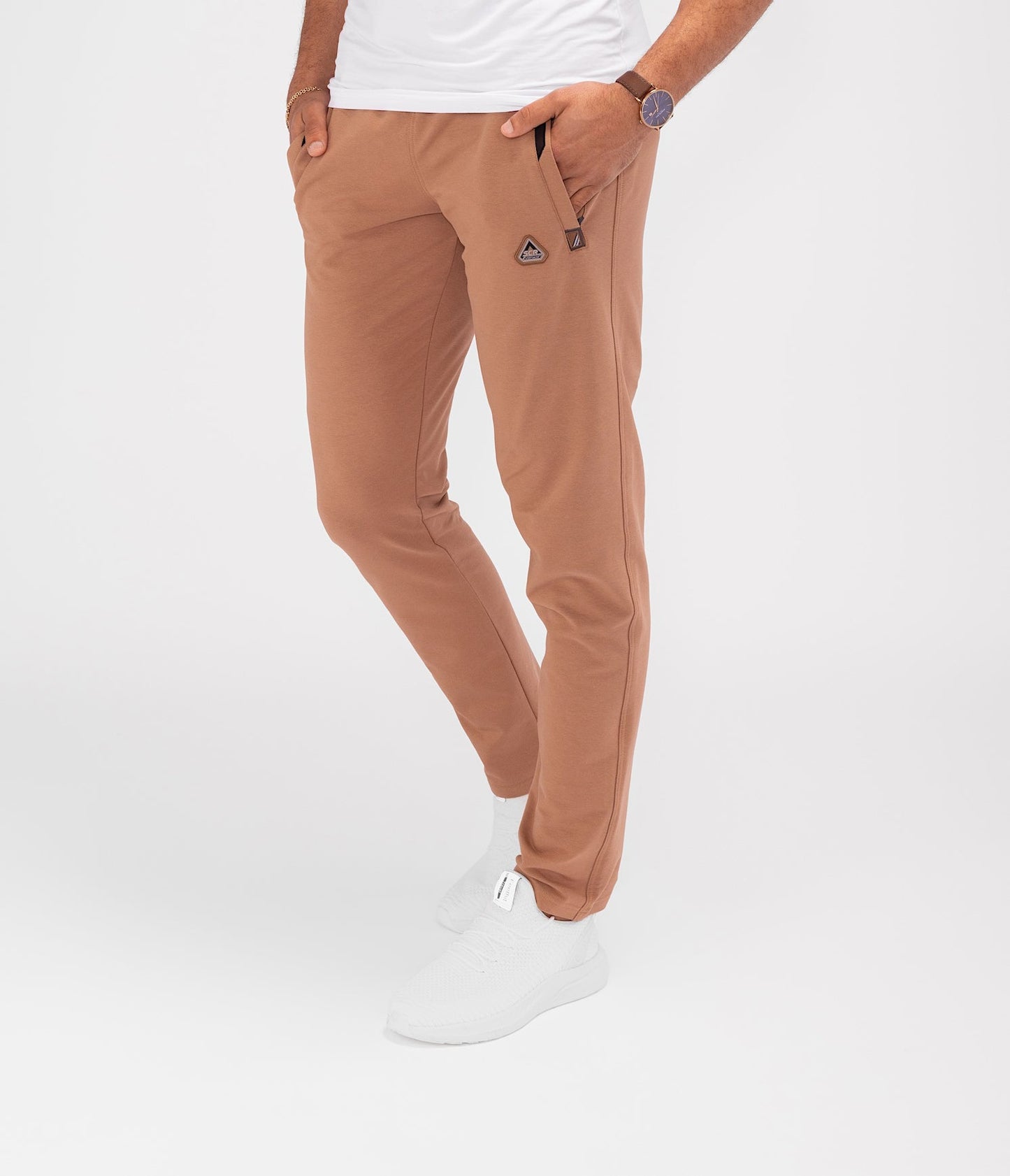 Rust brown tapered athletic sweatpants with elastic waistband and side pockets