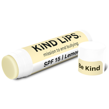 SPF 15 lemon lip balm tube with cap and Be Kind label