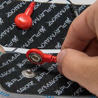 Electrode patch with snap connector and red lead wire, close-up