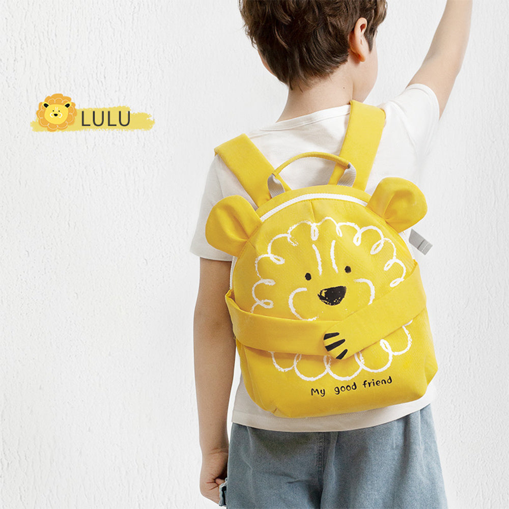 Children's yellow lion backpack worn by child with front face applique and shoulder straps