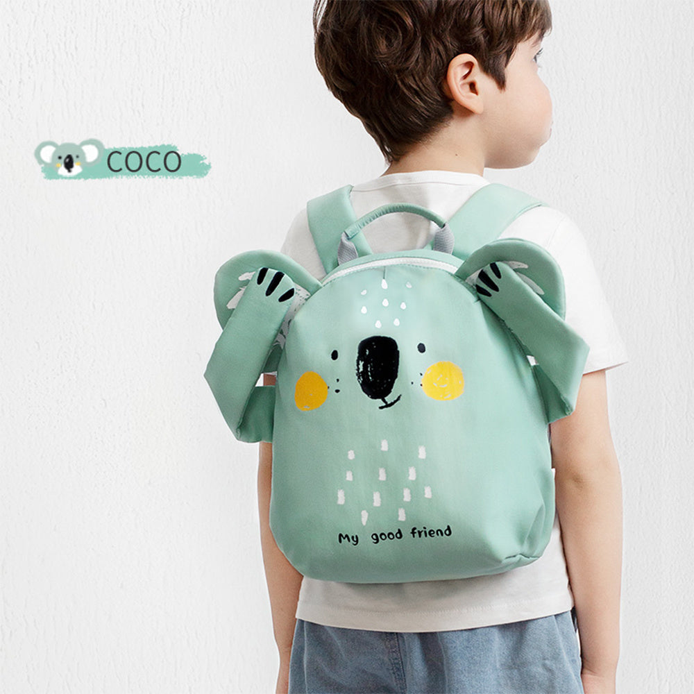 Kids mini backpack in light teal with animal face, worn on child’s back