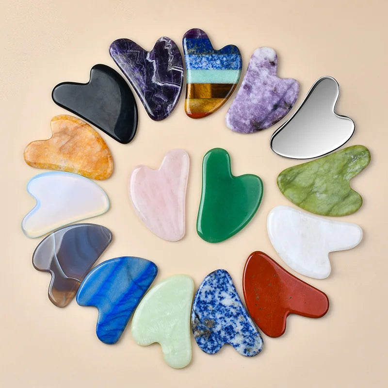 Facial gua sha stone set, assorted translucent shapes in dark, blue, green, and pink tones