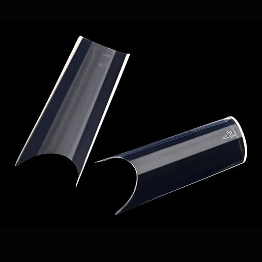 Transparent curved full-cover fake nail tips, two pieces with curved side cutouts.