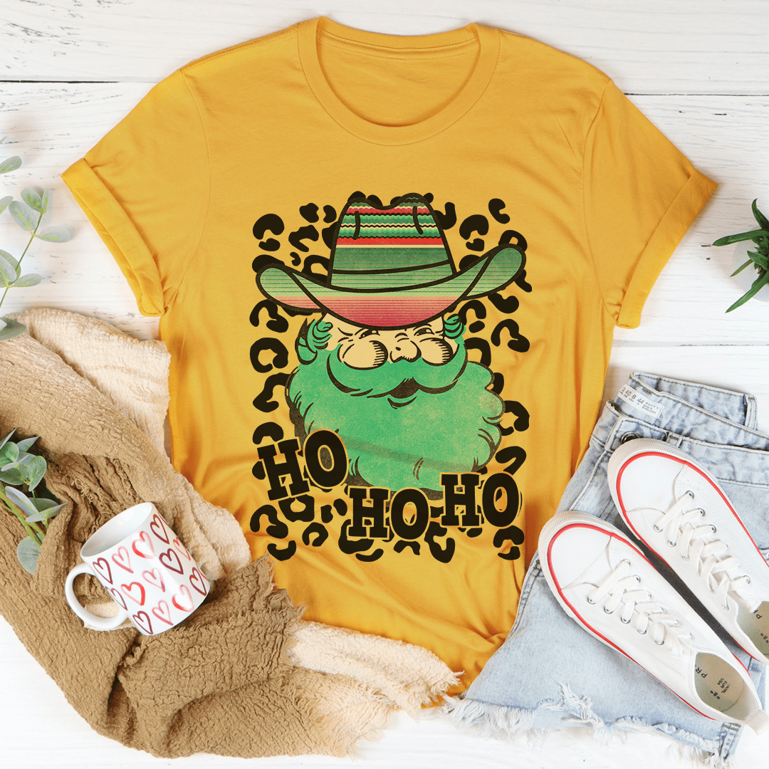 Santa cowboy graphic T-shirt in mustard yellow with hat-and-beard “HO” print