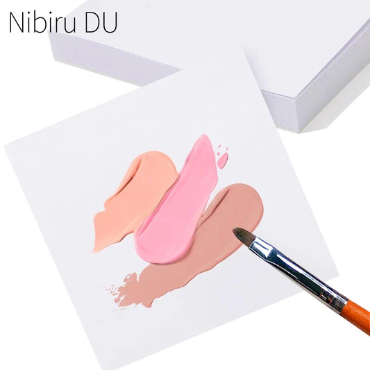 Disposable gel nail polish palette paper sheet with pink and peach swatch marks