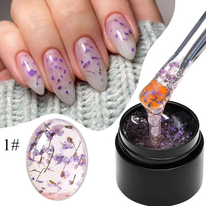 Lavender gel nail polish with purple dried flower nail art and gel bottle