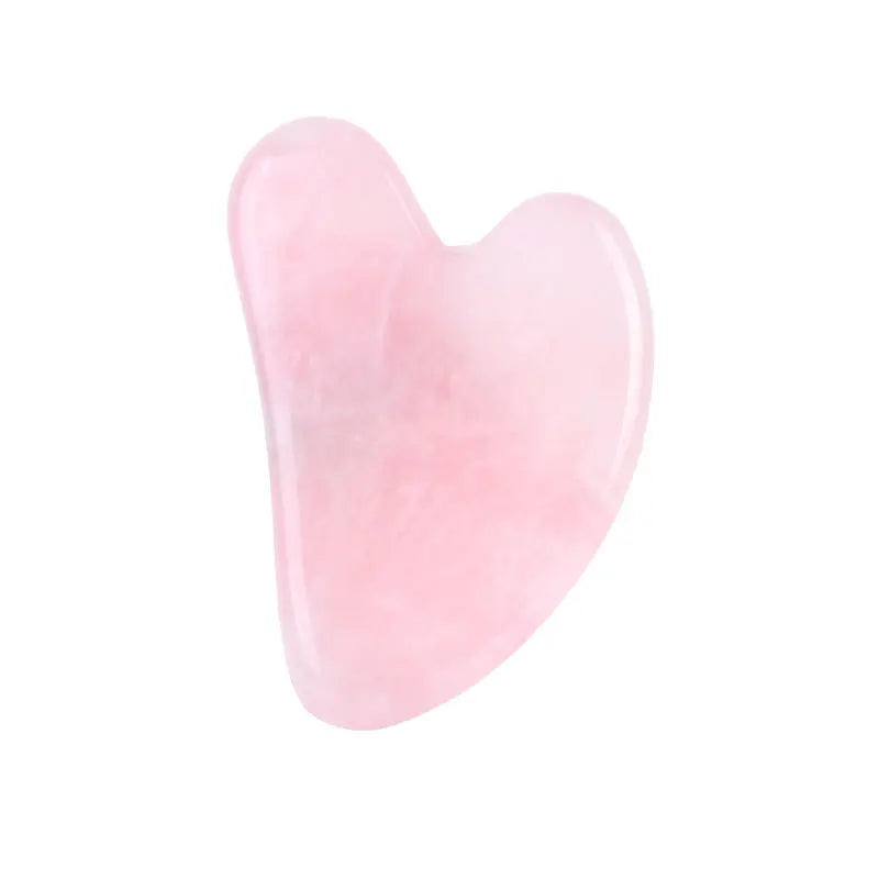 Facial gua sha stone tool, pale pink translucent heart shape