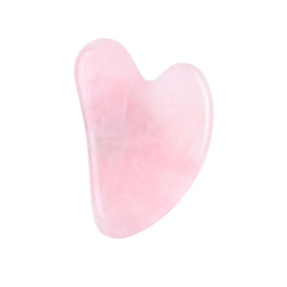 Facial gua sha stone tool, pale pink translucent heart shape