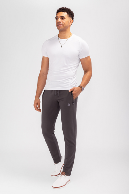 Dark gray tapered athletic sweatpants with elastic waistband and side pockets
