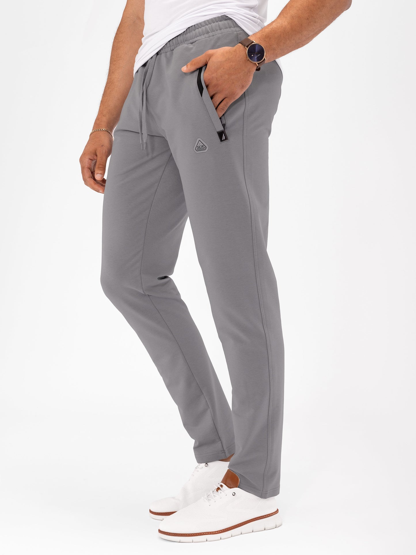 Dark grey athletic sweatpants, tapered fit, elastic waistband with drawstring and zip pocket