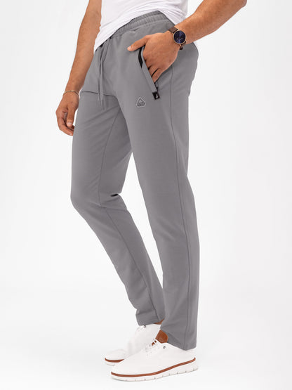 Dark grey athletic sweatpants, tapered fit, elastic waistband with drawstring and zip pocket
