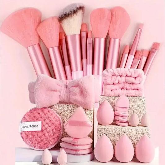 Pink makeup brush set with bow holder, cleaning sponge, and teardrop sponges