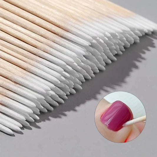 Wooden-tip cotton swabs with tapered white cotton heads for detailed nail cleanup
