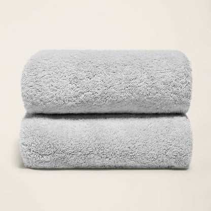Light gray cotton towel set, plush folded towels with terry loop texture