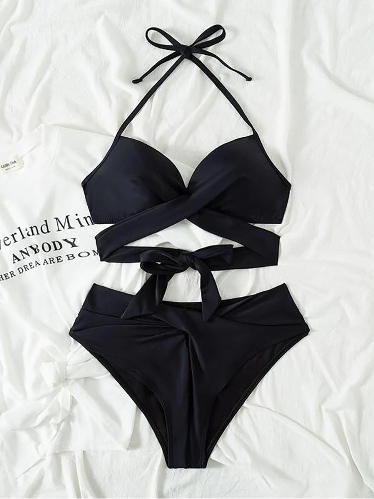 Black high-waist push-up bikini set with crisscross halter straps and tie accents