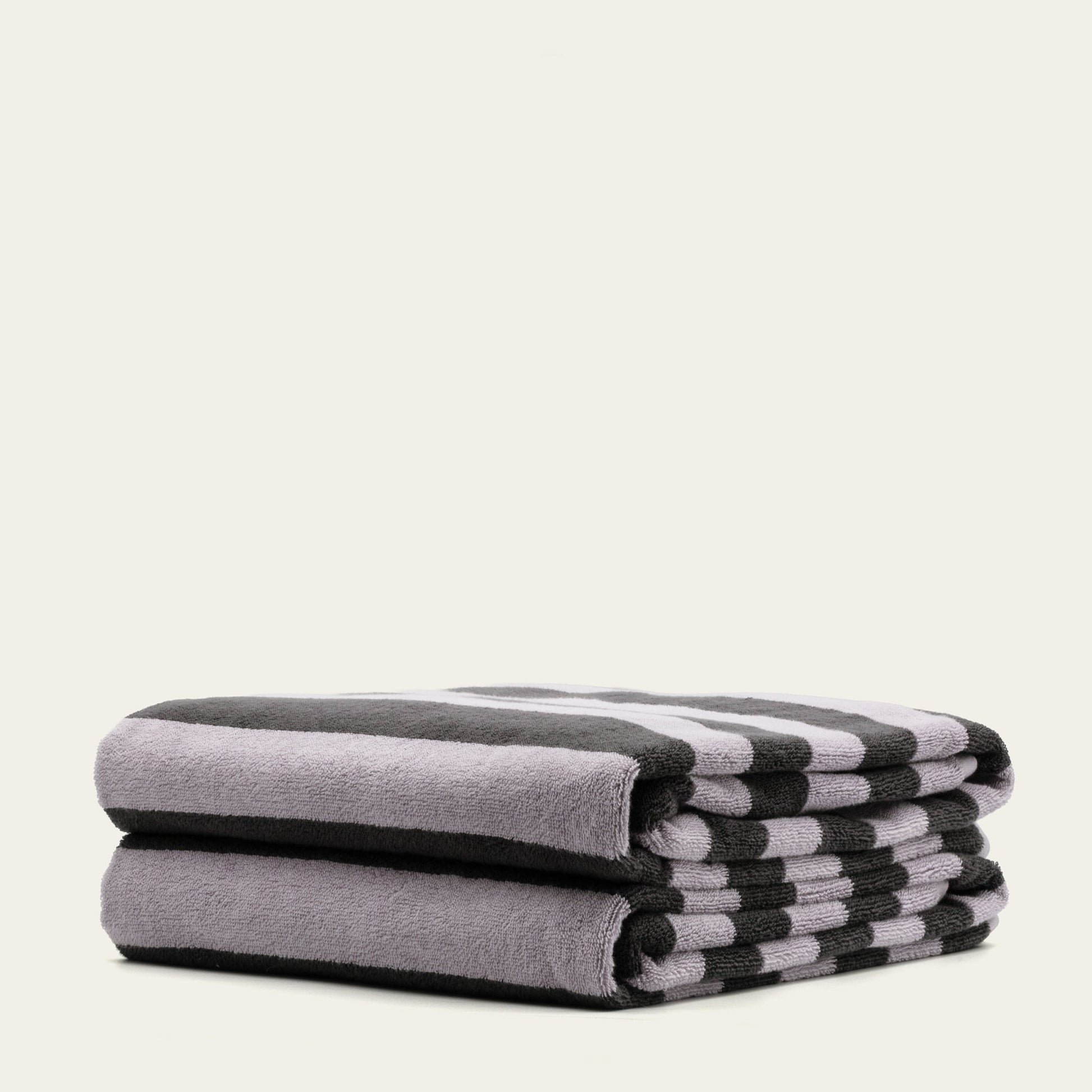 Australian cotton towel stack with lilac and dark charcoal striped ends