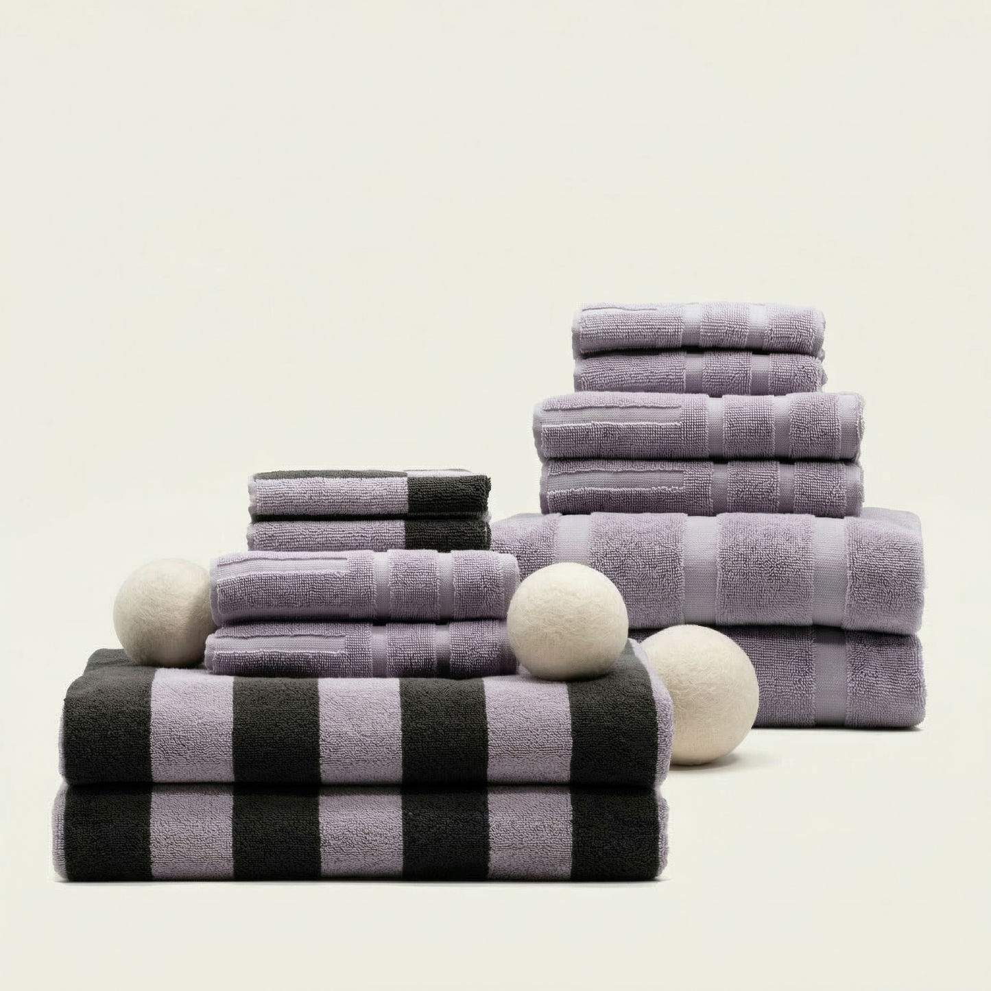 Australian cotton towels with lilac-and-charcoal checkered bands, folded and stacked