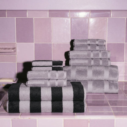 Australian cotton towels stacked in light gray-lilac and dark charcoal stripes