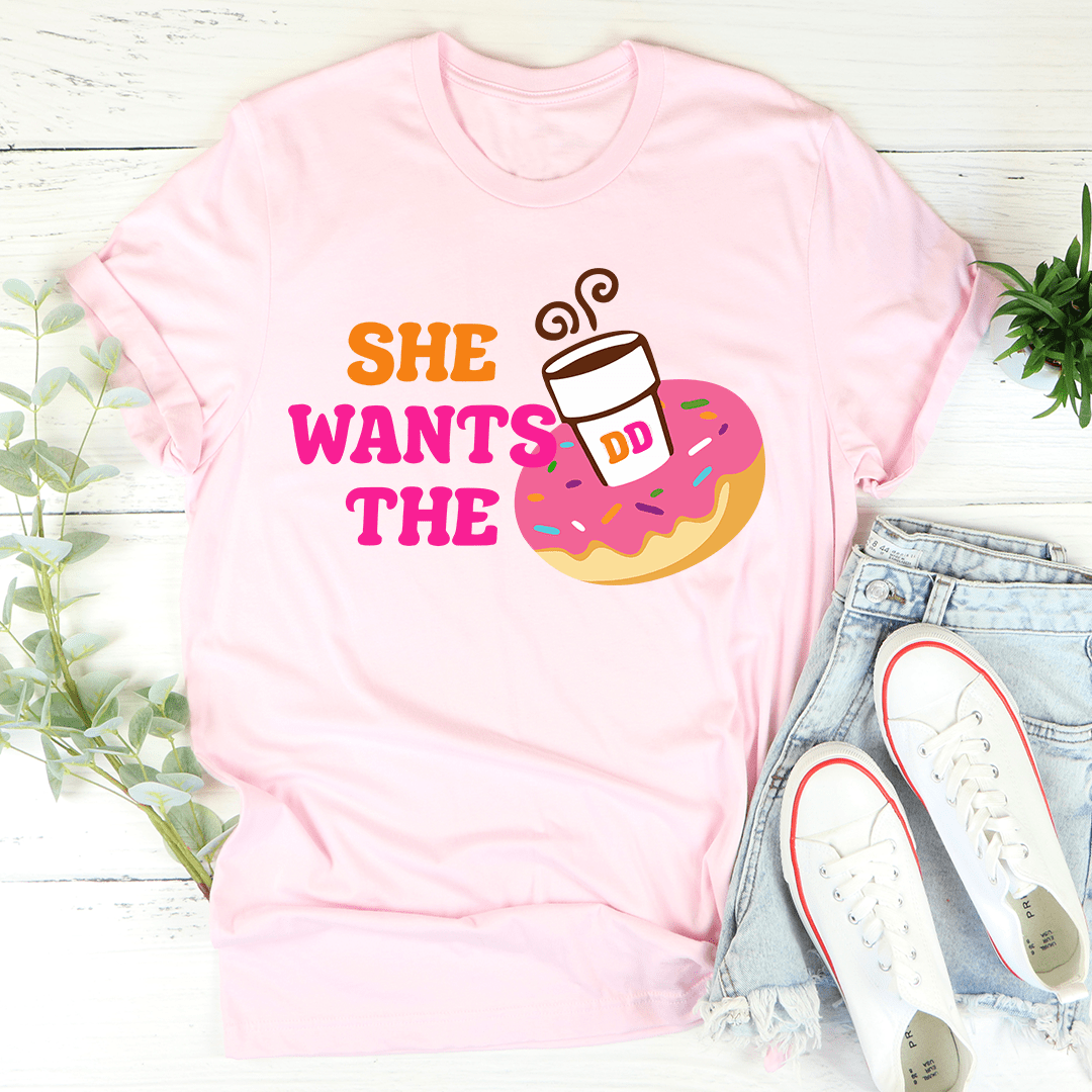 Pink T-shirt with colorful donut graphic and 'She Wants the' lettering