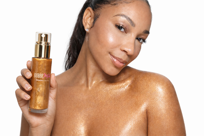 Shimmering body oil bottle held up near face, bronzed glittery skin