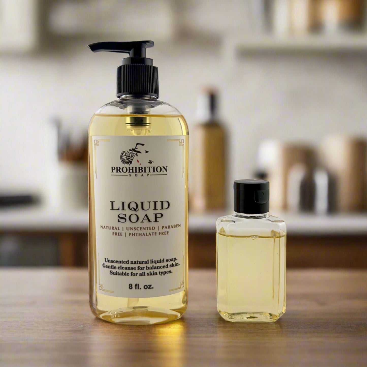 Liquid hand soap bottles with black pumps: large and small, clear yellow liquid