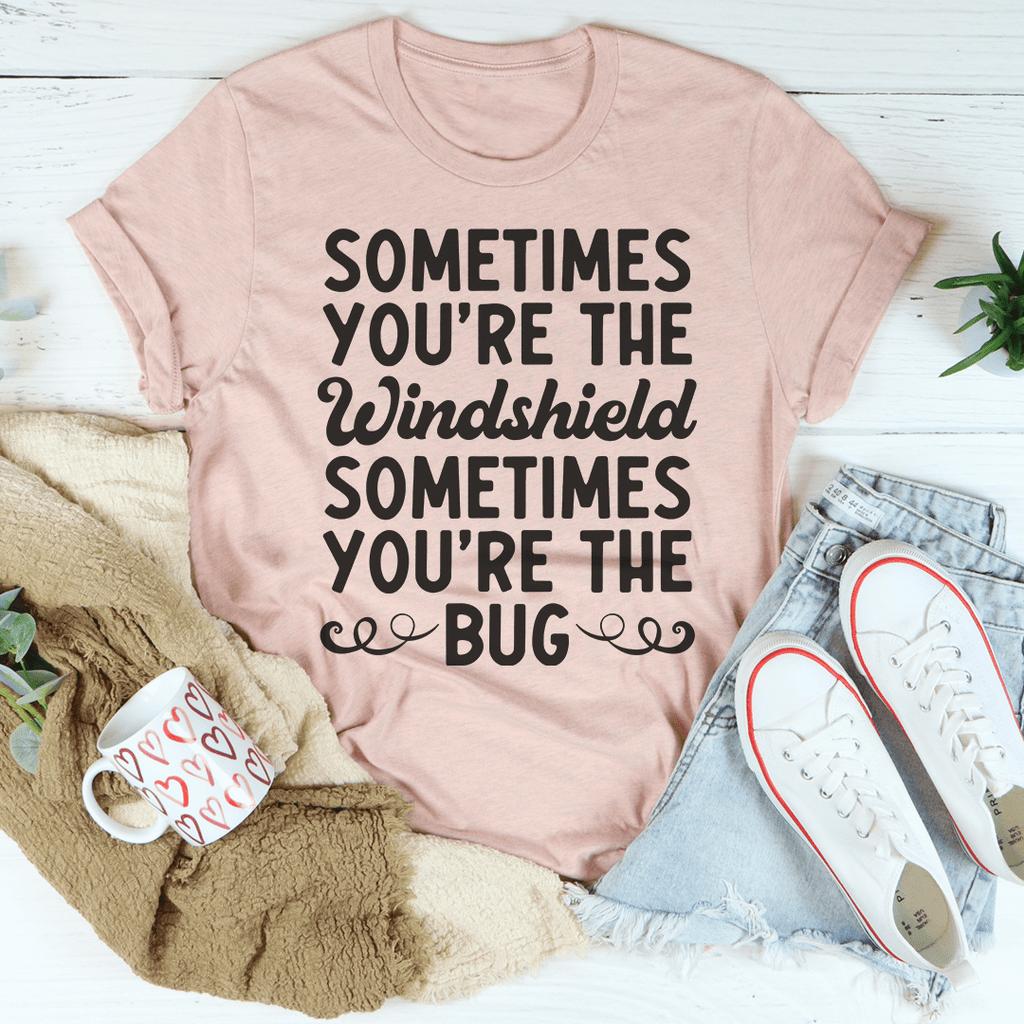Light pink crewneck T-shirt with bold "Windshield" and "Bug" text graphic