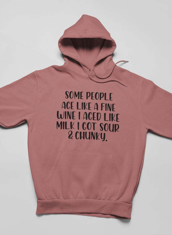 Pink pullover hoodie with front slogan graphic and kangaroo pocket