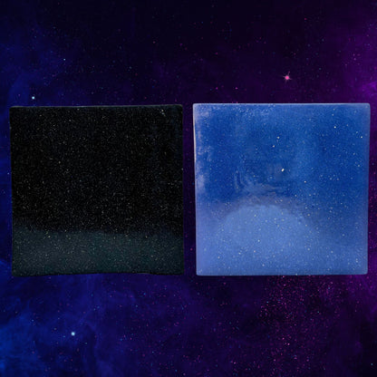 Zero Gravity soap bars, dark and blue speckled rectangular cubes, front views