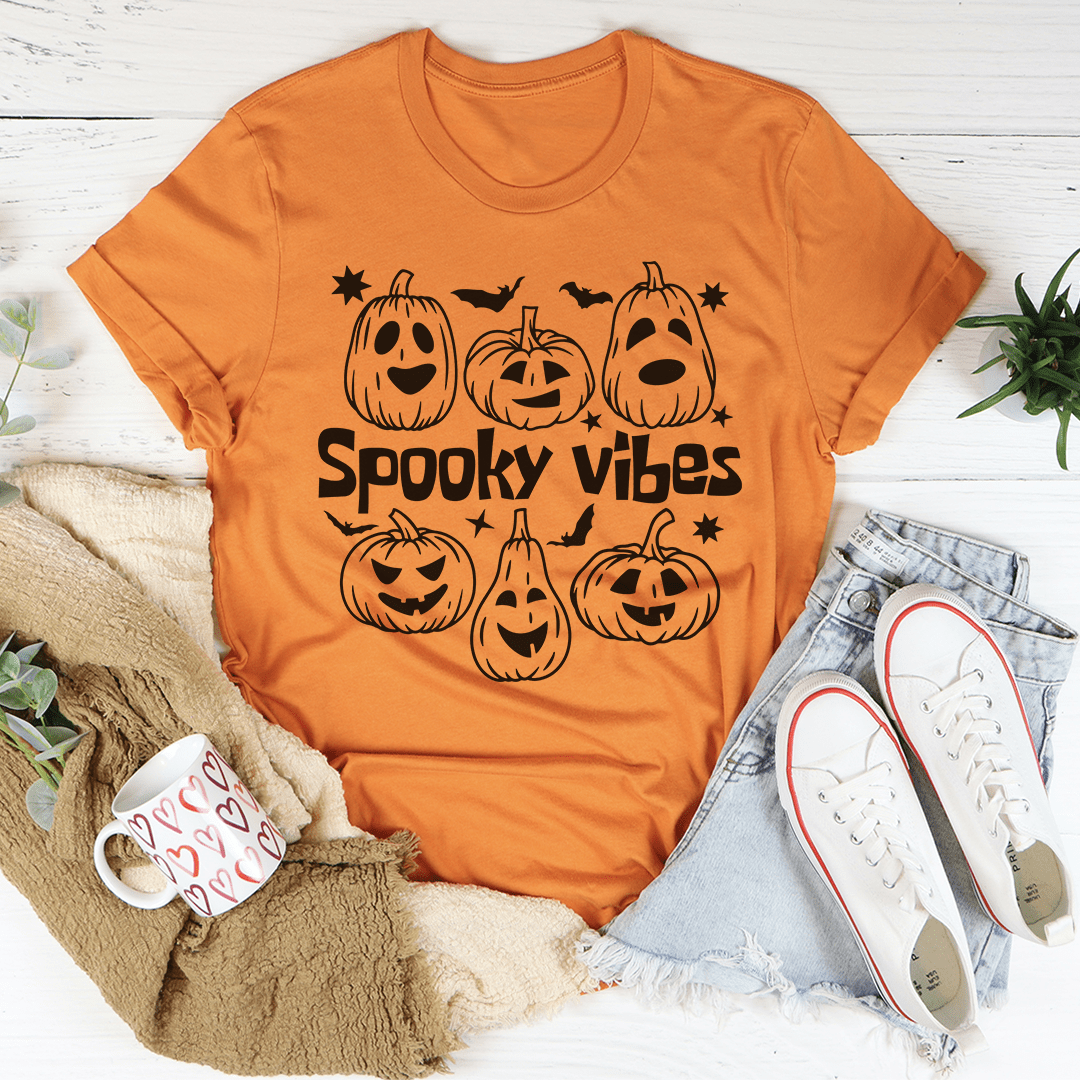Burnt orange crewneck t-shirt with “Spooky Vibes” jack-o’-lantern and ghost print