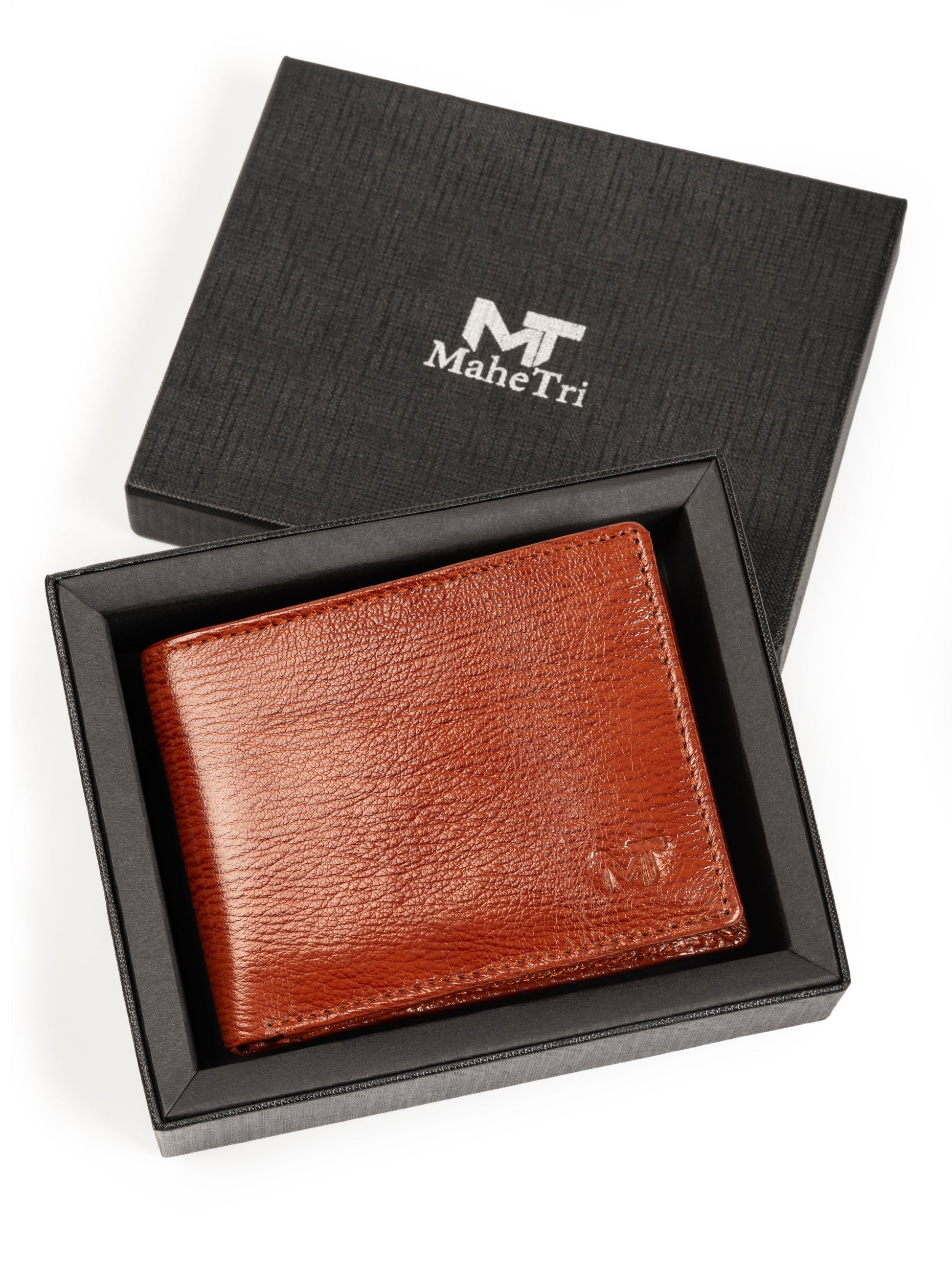 Men's tan-brown leather wallet resting in open black gift box