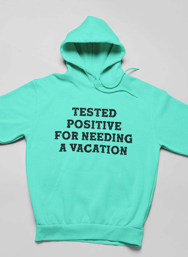 Mint green hoodie with front graphic text and kangaroo pocket