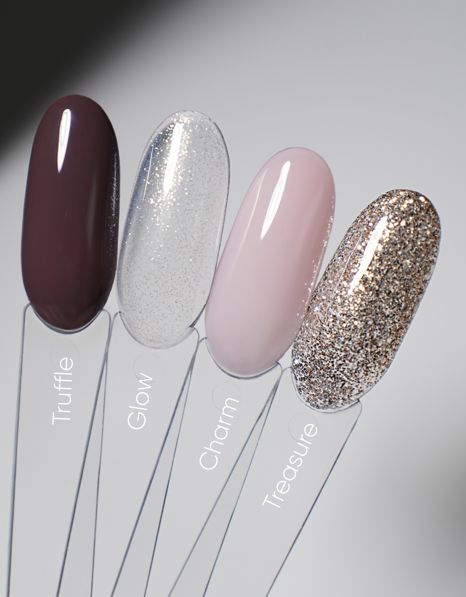 Nail polish swatch set with four glossy tips: dark burgundy, silver glitter, blush pink, gold glitter.
