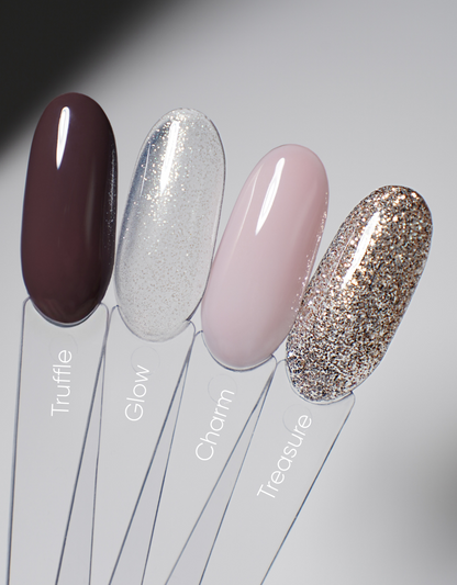 Nail polish swatch set with four glossy tips: dark burgundy, silver glitter, blush pink, gold glitter.
