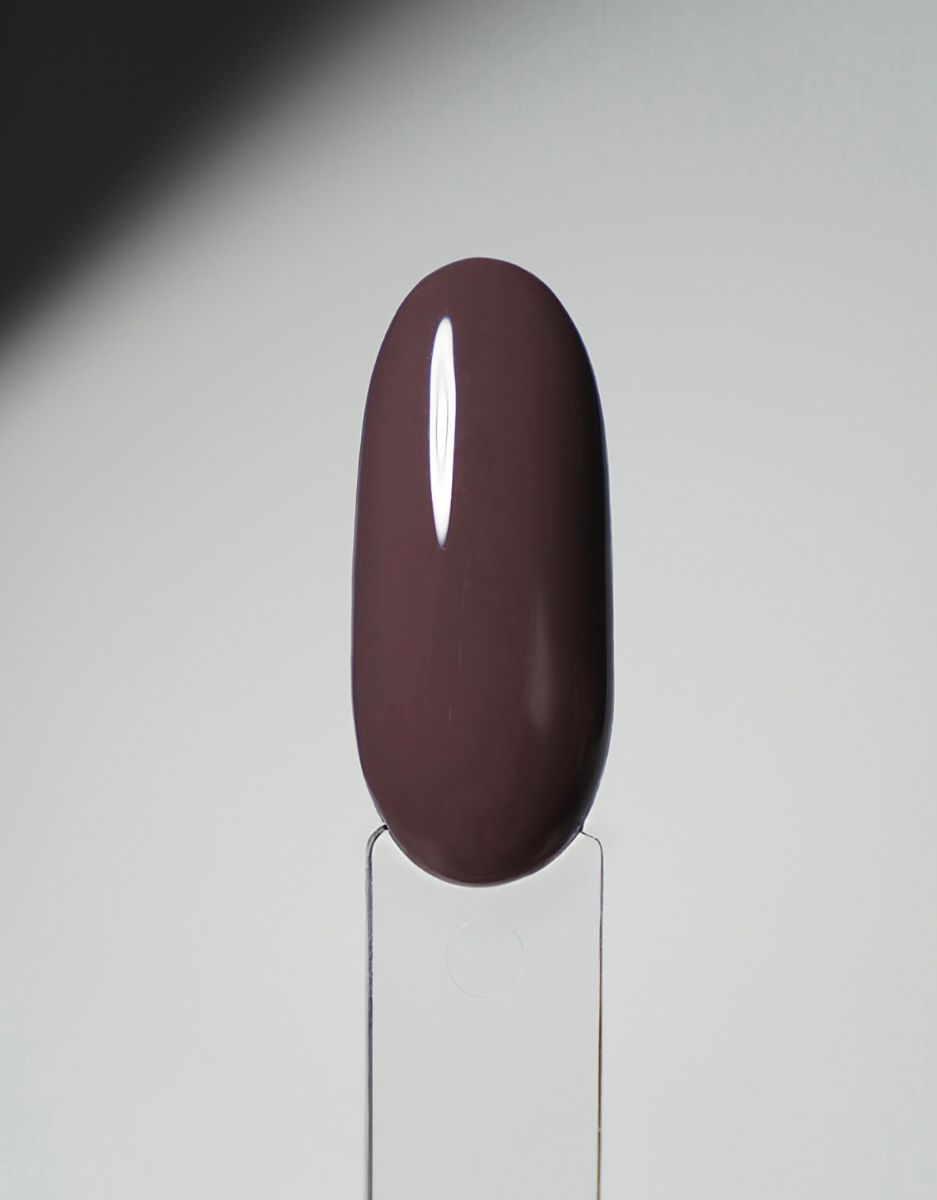 Glossy nail polish swatch tip in dark burgundy on a clear display holder.