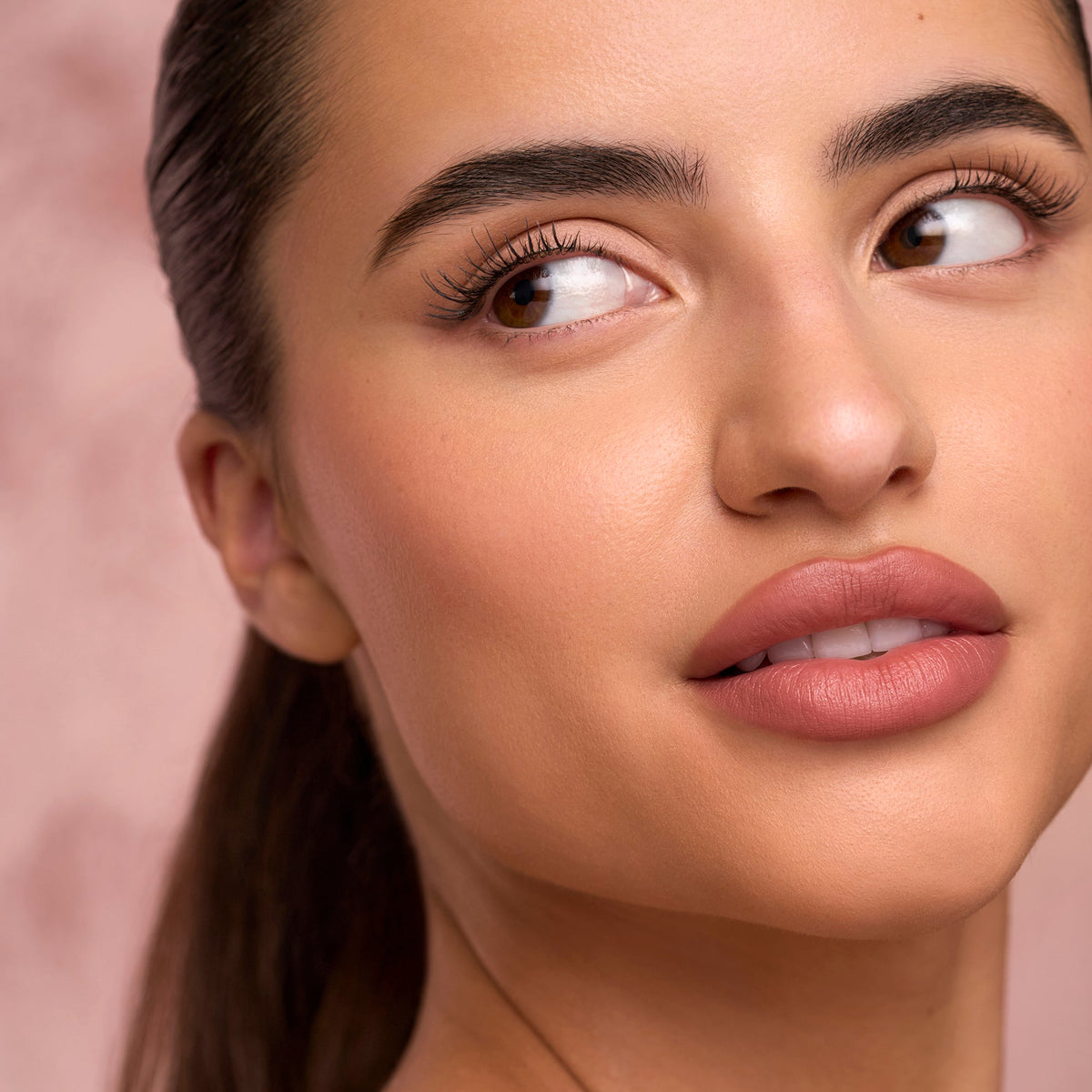 Lash routine set effect: model close-up with fuller, curled eyelashes