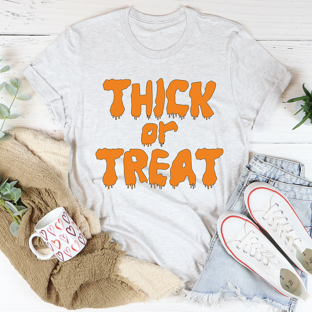 Light heather T-shirt with orange dripping 'THICK or TREAT' graphic on front