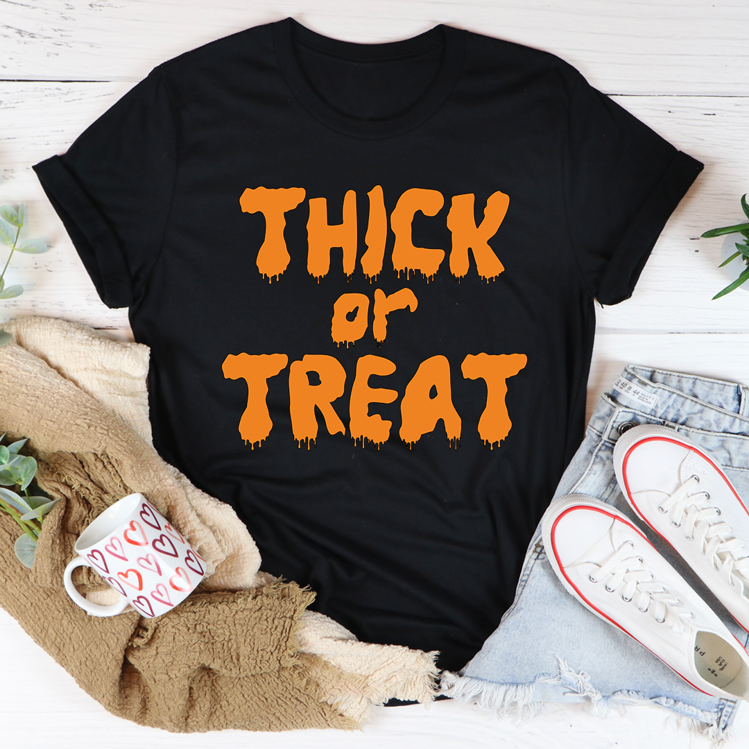 Black crewneck T-shirt with orange “Thick or Treat” dripping text on front