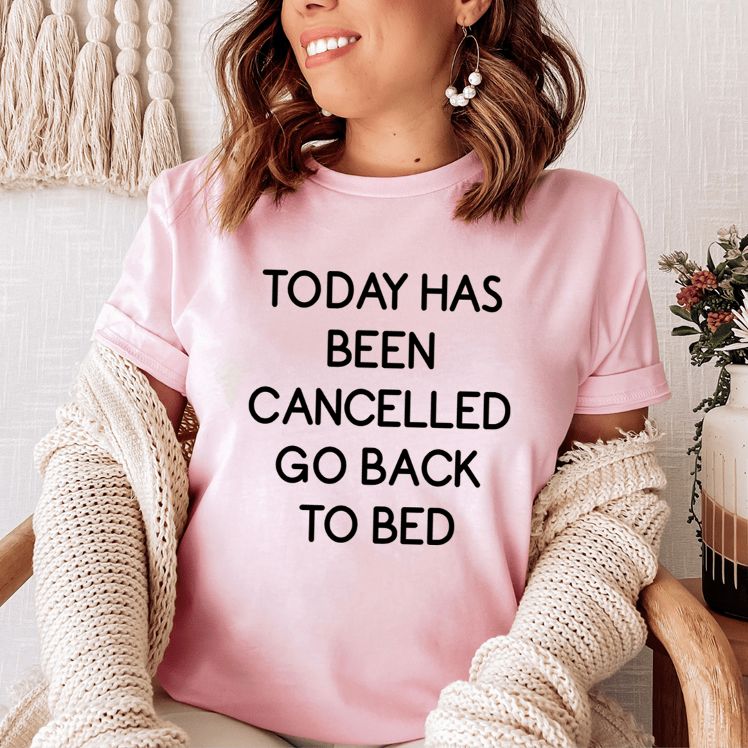 Pink women’s graphic T-shirt with black slogan: “TODAY HAS BEEN CANCELLED”