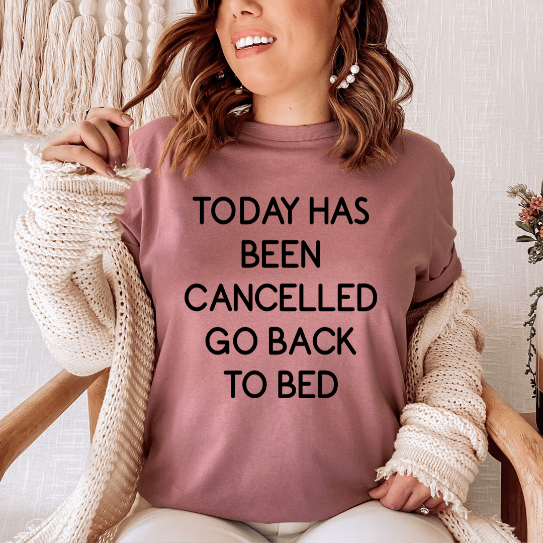 Mauve women’s graphic T-shirt with black slogan: “TODAY HAS BEEN CANCELLED”