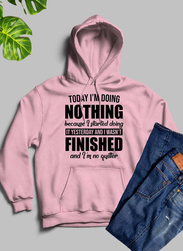 Pink hoodie with large front graphic text reading “NOTHING”