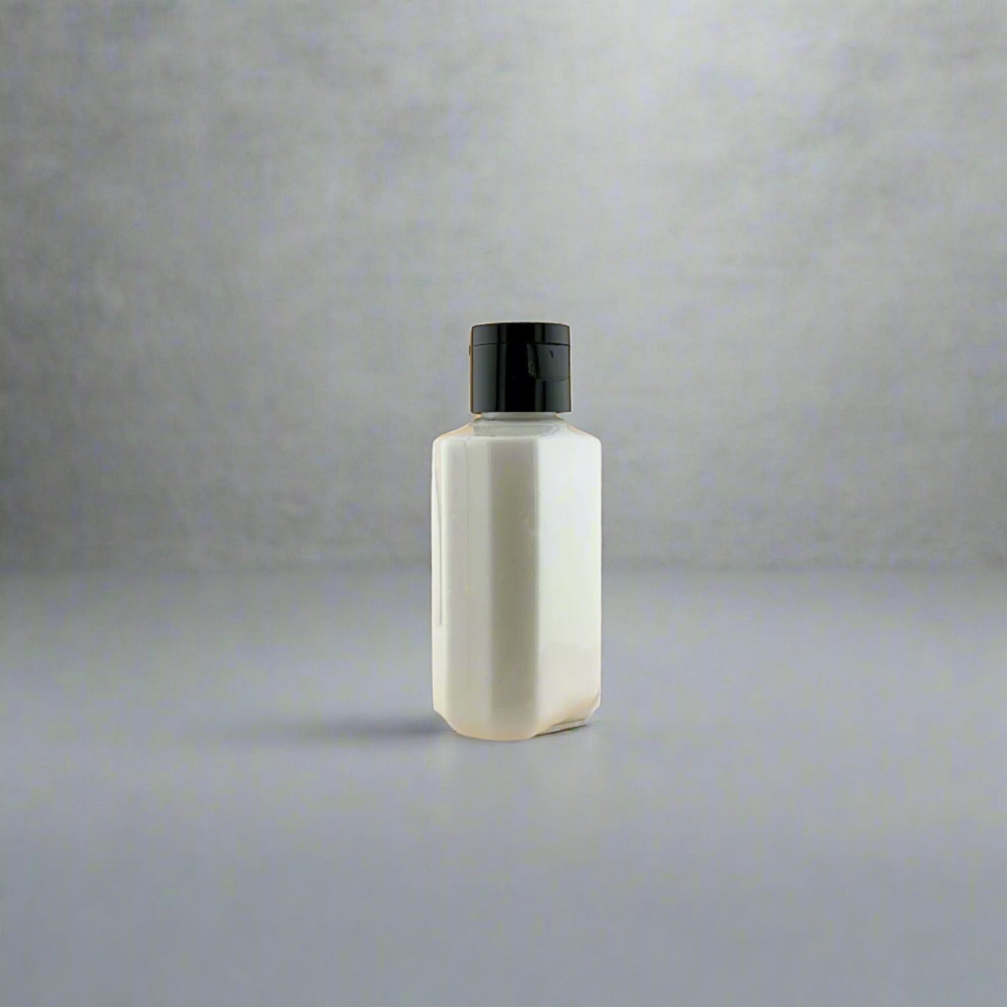Fragrance-free lotion bottle with black pump dispenser, small bottle front view