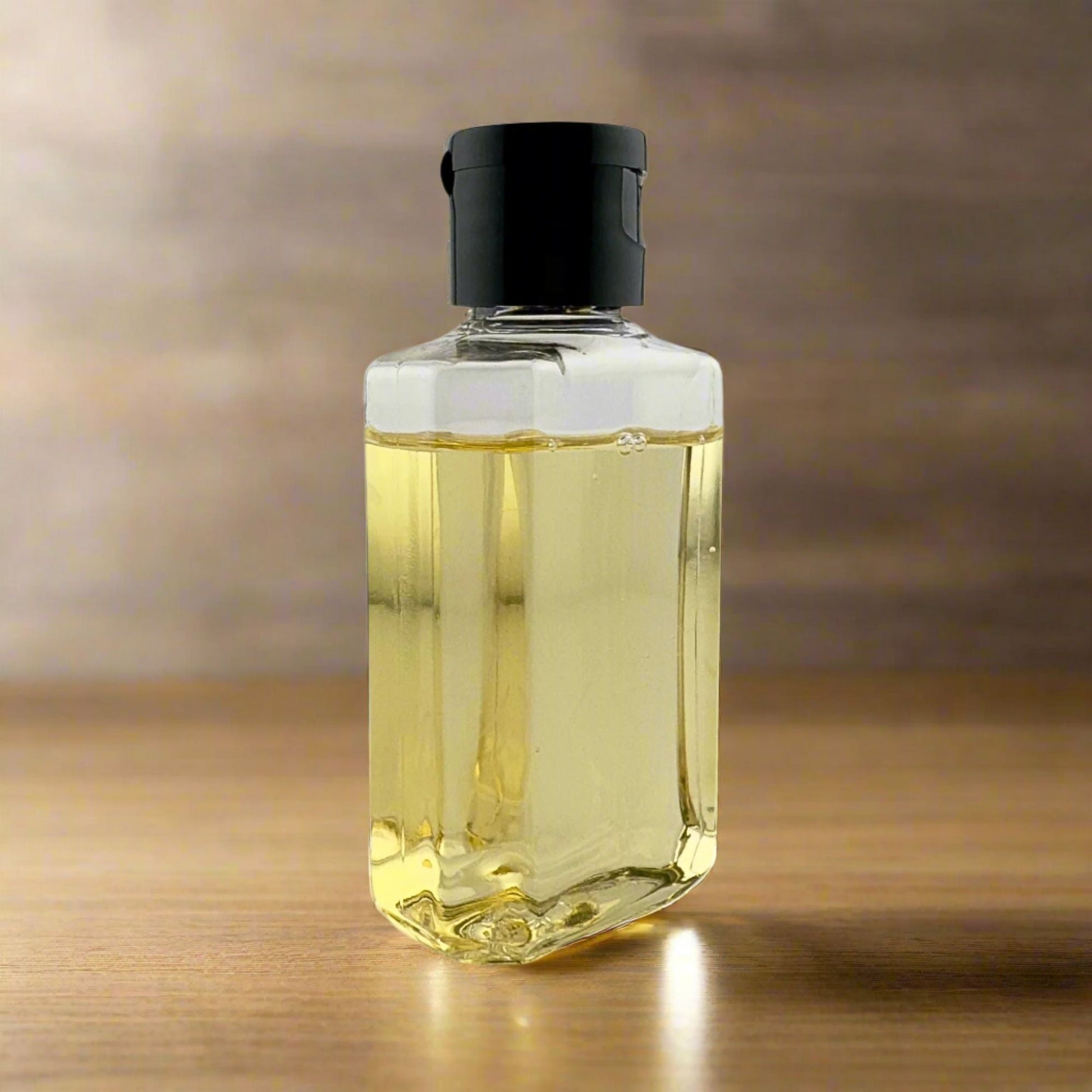 Liquid hand soap bottle with black pump, clear yellow liquid front view